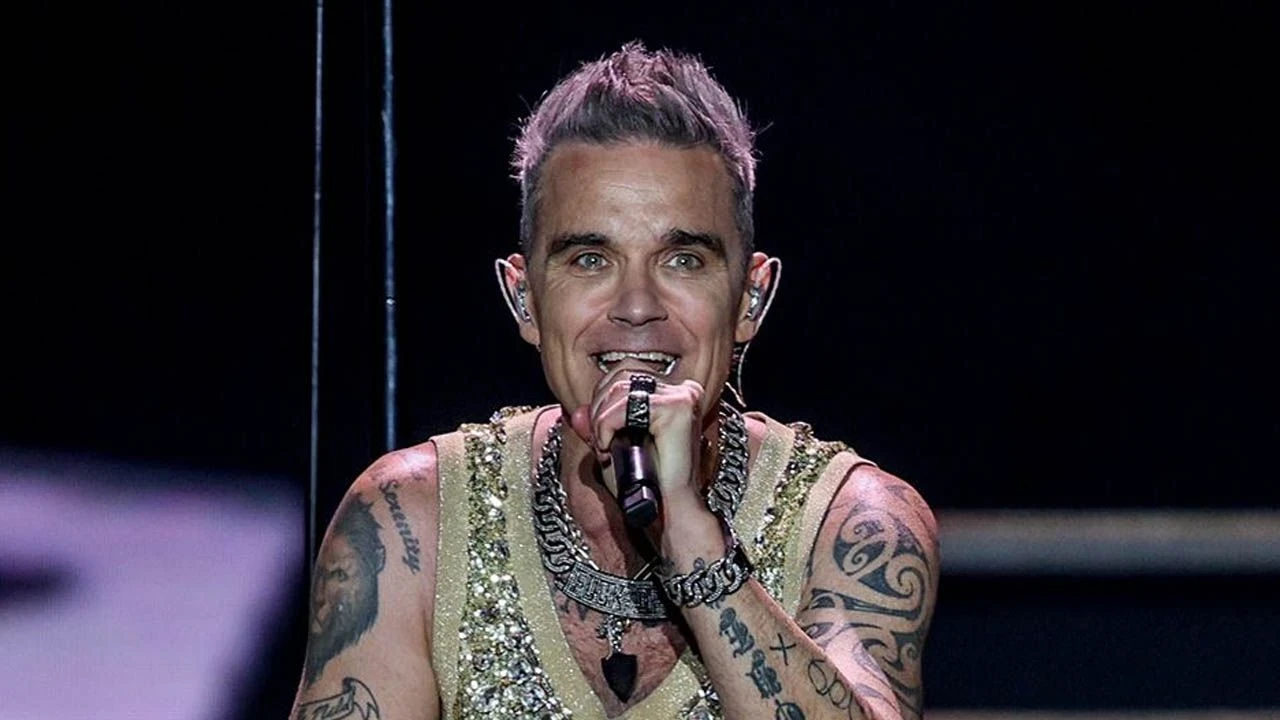 Robbie Williams: Müzik Dünyasının İkonu ve Kişisel Mücadeleleri ile Büyüleyen Sanatçı