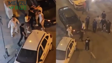 Sokak ortasında meydan savaşı: Otomobilin üstüne yatırıp acımasızca dövdüler